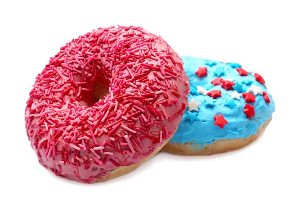 Deliciosas rosquillas acristaladas con salpicaduras sobre fondo blanco —  Fotos de Stock