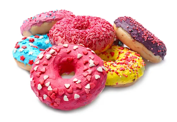 Heerlijke geglazuurde donuts met hagelslag op witte achtergrond — Stockfoto