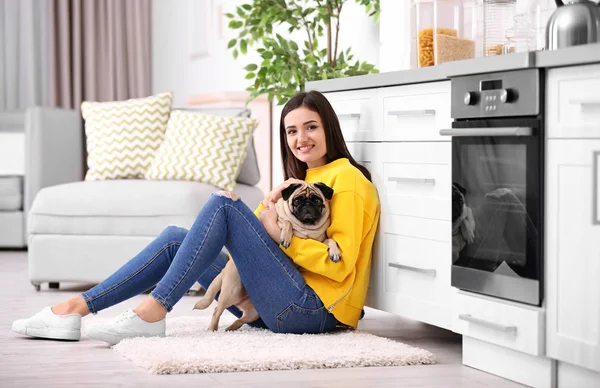 Woman with cute dog at home. Friendship between pet and owner — Stock Photo, Image