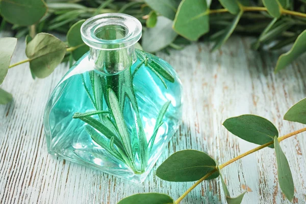 Bottle with perfume oil on table — Stock Photo, Image