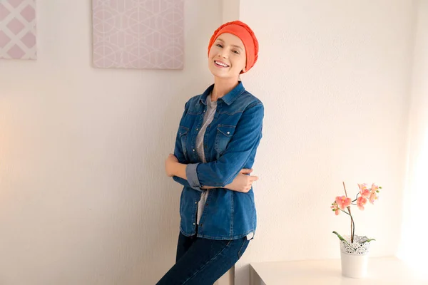 Young woman with cancer in headscarf indoors — Stock Photo, Image