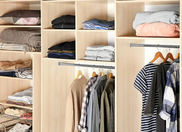 Large wardrobe closet with different clothes, shoes and home stuff — Stock Photo, Image