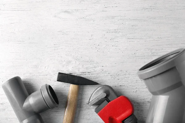 Plumbers items on table — Stock Photo, Image