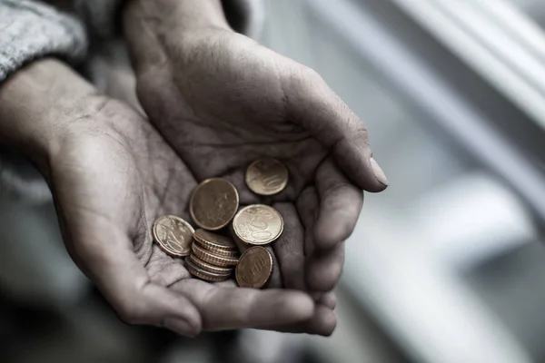 Poor woman holding coins, closeup — Stock Photo, Image