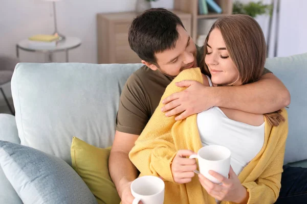 Young lovely couple drinking tea at home — Stock Photo, Image