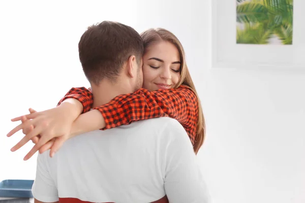 Cute young lovely couple hugging at home — Stock Photo, Image