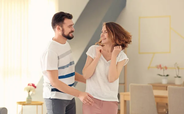 Lovely couple dancing together at home — Stock Photo, Image