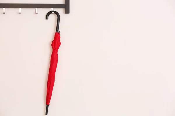 Stylish Red Umbrella Hanging Wall Indoors — Stock Photo, Image