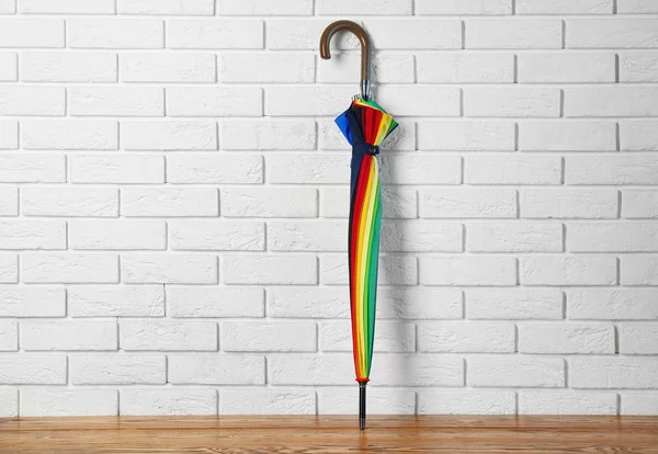 Stylish Rainbow Umbrella Brick Wall — Stock Photo, Image