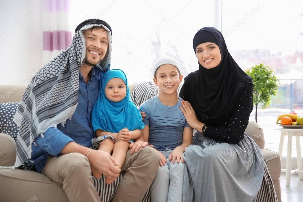 Happy Muslim  family  spending time together at home  Stock 
