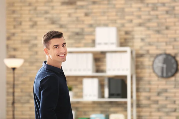Portrait of handsome young man in office — Stock Photo, Image