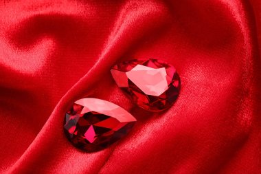 Precious stones for jewellery on red velvet clipart