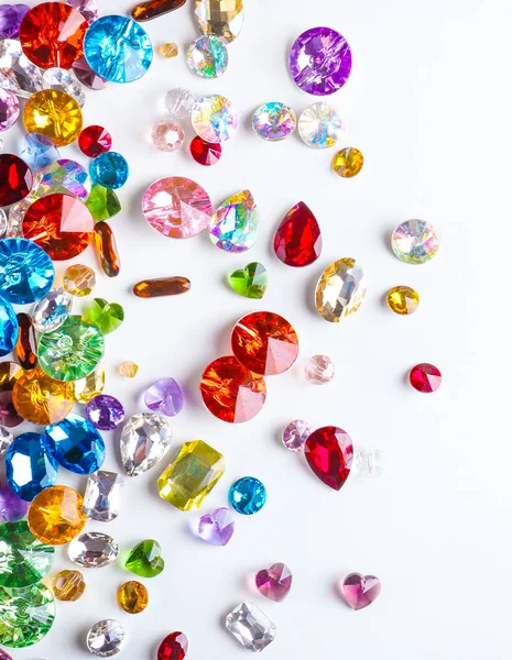 Colorful precious stones for jewellery on white background