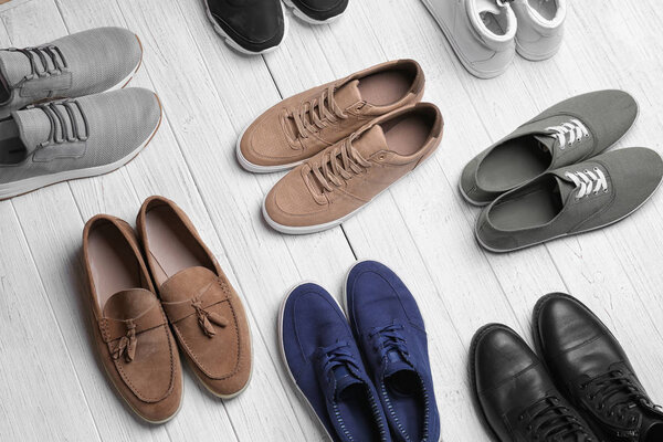 Different male shoes on light background