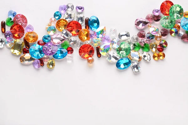 Composition of colorful precious stones for jewellery on white background — Stock Photo, Image