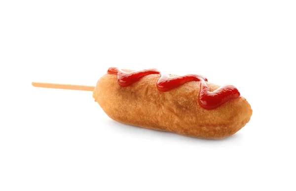 Tasty corn dog with ketchup on white background — Stock Photo, Image