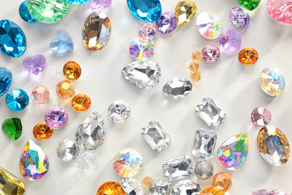 Colorful precious stones for jewellery on white background