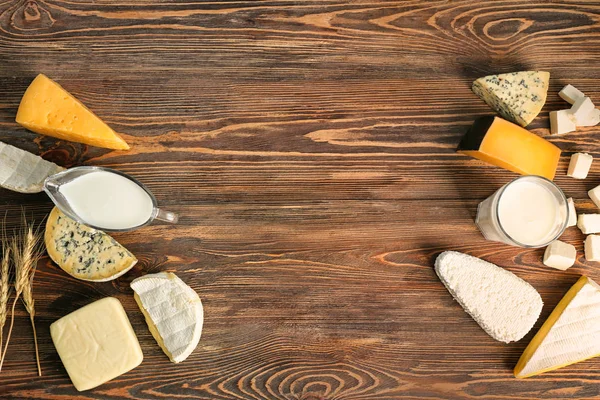 Fresh dairy products on wooden background — Stock Photo, Image