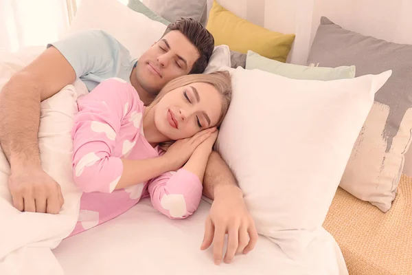 Young lovely couple sleeping in bed at home — Stock Photo, Image