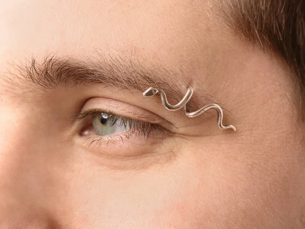 young man with pierced eyebrow