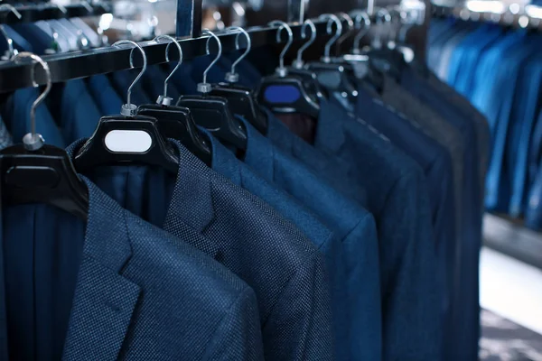 Rack with suit jackets — Stock Photo, Image