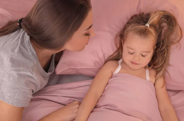 Mother looking at cute little daughter — Stock Photo, Image