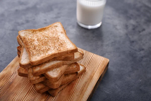 Board with toasted bread — Stock Photo, Image