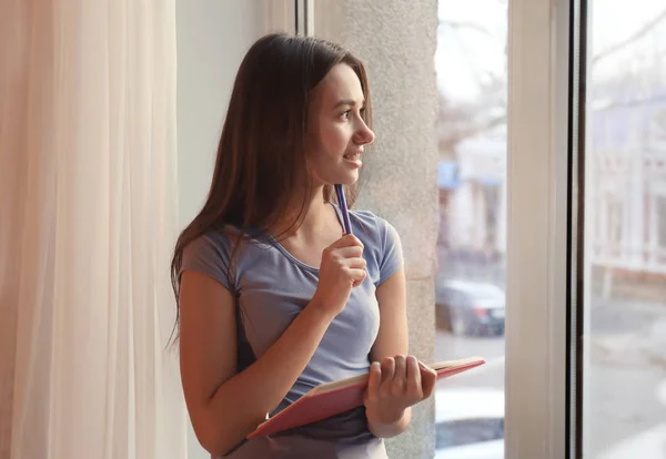 Cute teenager girl  doing homework — Stock Photo, Image