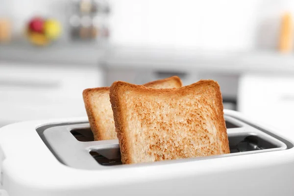 Slices of bread in toaster — Stock Photo, Image