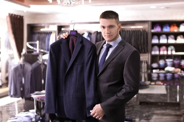 Man choosing elegant suit — Stock Photo, Image