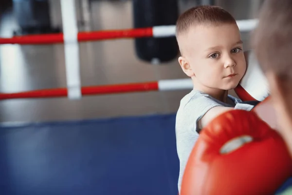 Little boy training with coach in boxing ring — Stock Photo, Image