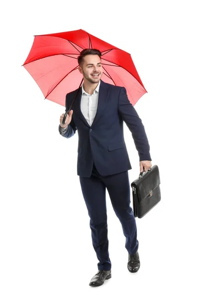 Jovem com guarda-chuva vermelho e pasta sobre fundo branco — Fotografia de Stock