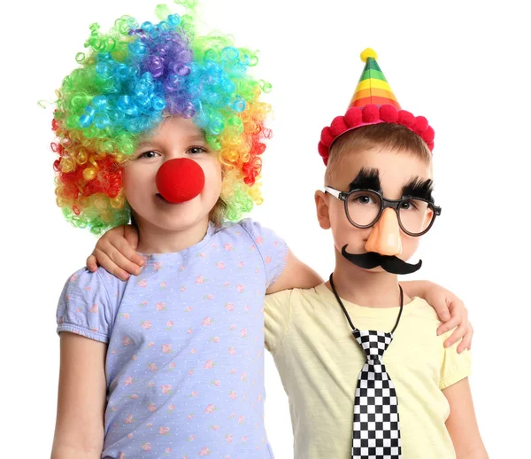 Lindos niños pequeños disfrazados de gracioso sobre fondo blanco. Celebración del día del tonto de abril —  Fotos de Stock