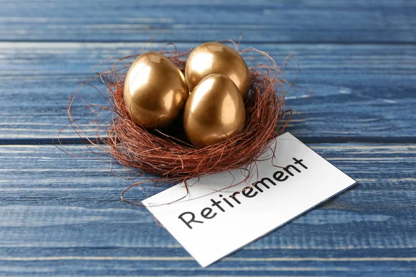 Golden Eggs Nest Sign Retirement Wooden Background Pension Planning — Stock Photo, Image