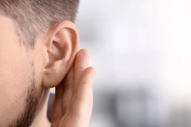 Mature man with hearing problem clipart