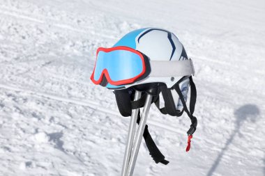 Ski equipment on piste at snowy resort. Winter vacation clipart