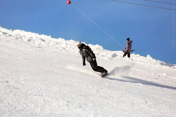 Snowboarder on ski piste — Stock Photo, Image