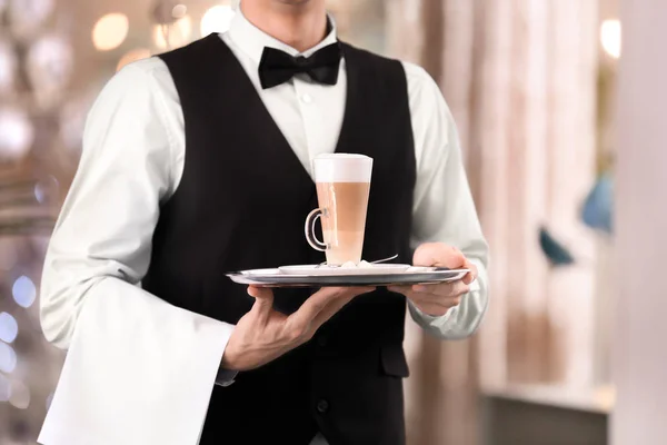 Waiter holding tray with cup of coffee — Stock Photo, Image