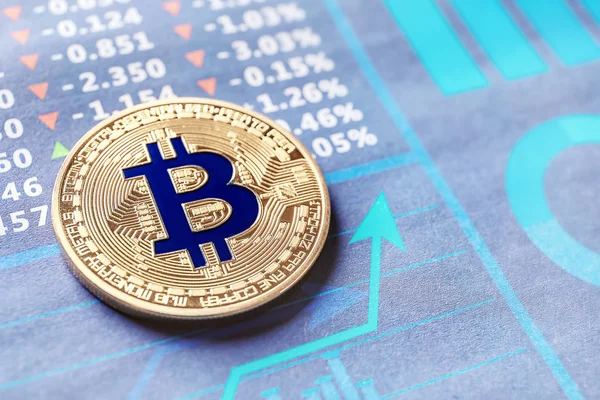 Golden bitcoin on chart — Stock Photo, Image