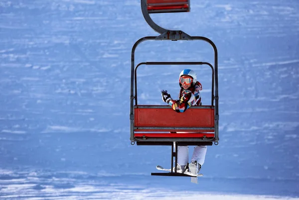 Woman on ski lift — Stock Photo, Image