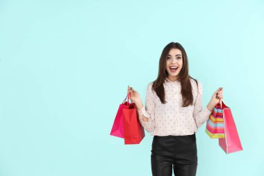 young woman with shopping bags clipart