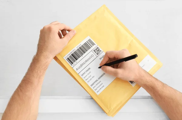 Close Young Man Preparing Parcel Envelopes Shipment Client Home — Stock Photo, Image