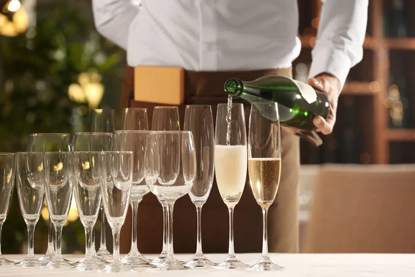 Waiter Pouring Champagne Glasses Indoors — Stock Photo, Image