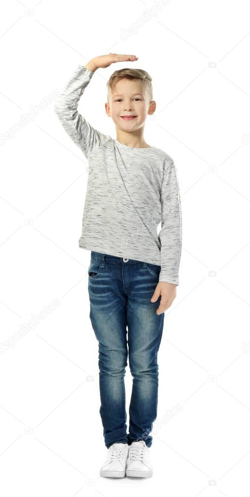 little boy measuring height on white background