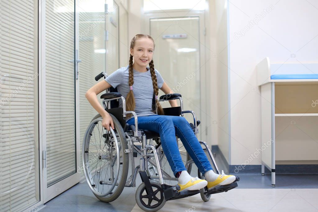 Little Girl Sitting Wheelchair Indoors — Stock Photo © belchonock