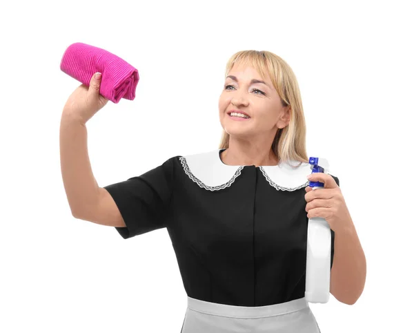 Portrait of mature woman in uniform with detergent and rag on white background — Stock Photo, Image