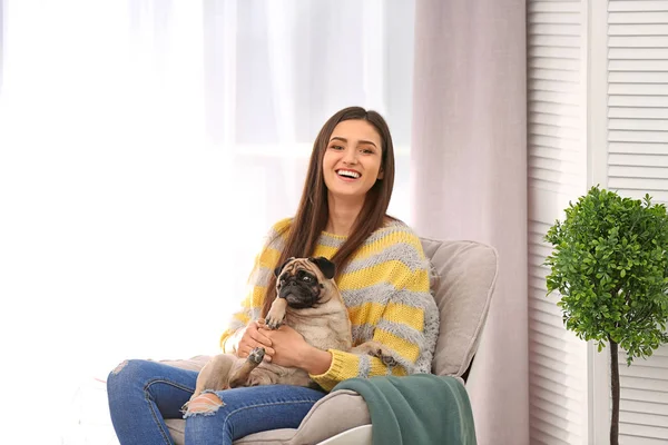 Woman with cute dog at home. Friendship between pet and owner — Stock Photo, Image