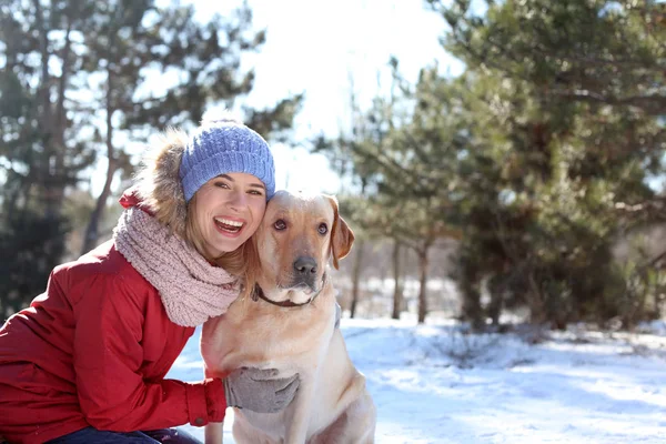 Portrait of woman with cute dog outdoors on winter day. Friendship between pet and owner — Stock Photo, Image