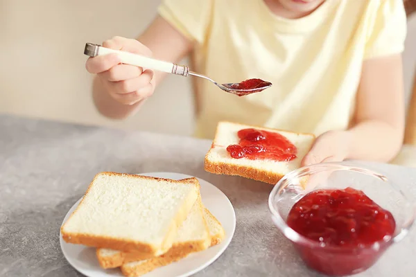 Little Girl Spreading Jam Toast Home — Stock Photo, Image