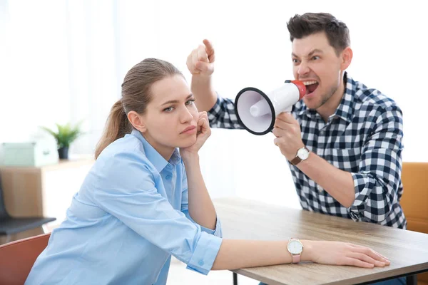 Boss with megaphone screaming at employee — Stock Photo, Image